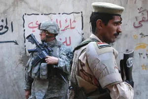 Iraq Prints: US and Iraqi army soldiers stand guard a market in the Al Doura district of Baghdad Iraq providing security for US
