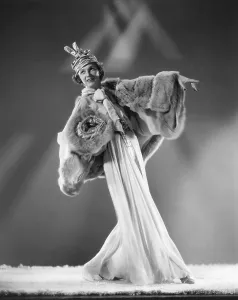 2 Mej Prints: Irene Castle recreating the costume she wore in the 1919 show Watch Your Step a blue chiffon dance gown with platinum