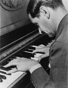 Classics Prints: Irving Berlin (1888-1989) composed at the piano, creating both music and lyrics