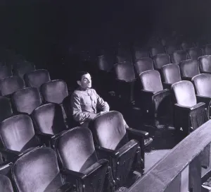 Classics Prints: Irving Berlin (1888-1989), seated alone in auditorium in 1942
