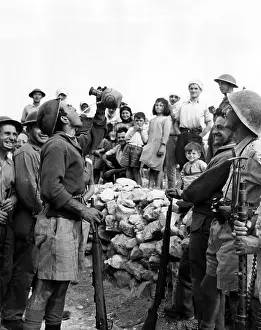 Guard Prints: Israeli troops drinking water in a traditional manner in which the spout never touches their lips
