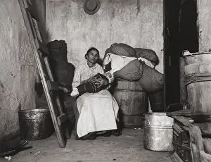 Dwelling Prints: Italian immigrant rag-picker sits with her baby in a small run-down tenement room