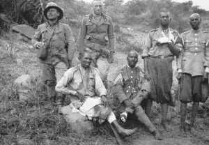 Captives Prints: Two Italian soldiers with four wounded barefoot Ethiopian POWs