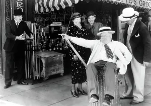 Trash Can Prints: IT'S A GIFT, Morgan Wallace (far left), W. C. Fields (in trash can), 1934