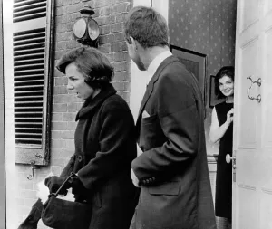 Funerals Prints: Jacqueline Kennedy, in doorway of her temporary Georgetown home after leaving the White House