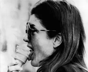 Profiles Prints: Jacqueline Kennedy Onassis licks an ice cream cone while on a shopping tour of Portofino
