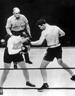 Farr Prints: James Braddock (right) pummels Tommy Farr and wins bout by decision in 10 rounds