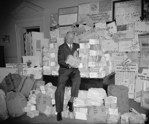 Democratic Prints: James Farley inspects letters sent during airmail week celebration. June 15, 1938