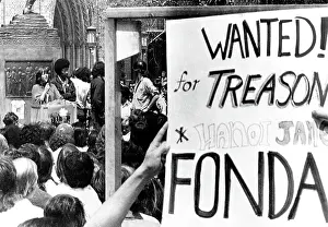 Speaking Prints: Jane Fonda (left), students holding anti-Jane Fonda sign while Fonda addresses students on the campus of Univ