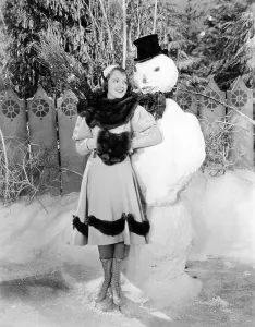Janet Prints: Janet Gaynor, cuddling up to a terrifying snowman, 1922