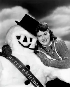 Top Hat Prints: Janis Paige offering Christmas greetings