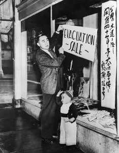 Ethnic Groups Prints: Japanese-American merchant posts a sale sign on his San Francisco store in preparation for internment