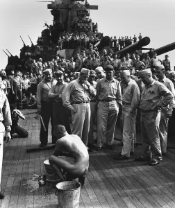 Captured Prints: Japanese prisoner aboard the USS NEW JERSEY, naked and bathing before hundreds of sailors