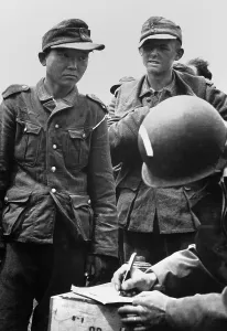 Identification Prints: Japanese youth, wearing a Nazi uniform