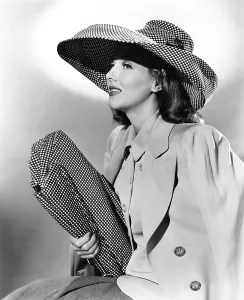 Parker Prints: Jean Parker, modeling a matching hat and handbag of black and white checks, 1941