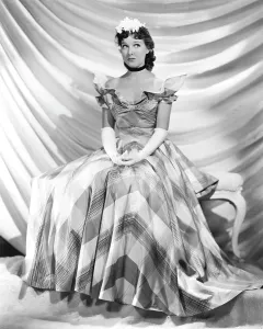 Parker Prints: Jean Parker, modeling a taffeta frock by Adrian, in brown and ivory plaid, 1937
