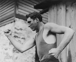 Tank Top Prints: Jess Willard, heavyweight boxer in a boxing post, Sept. 3, 1912