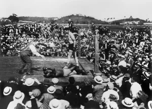 Bare Chested Prints: Jess Willard standing over a knocked out boxer Jack Johnson, as the referee counts to 10
