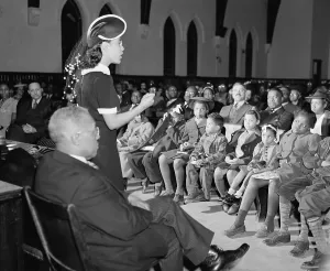Leadership Prints: Jewal Mazique, speaking in a church on African Americans role in the World War 2 effort