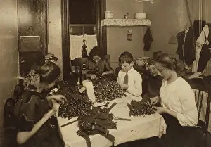 Apartment Prints: Jewish family working on garters in kitchen of a New York City tenement