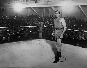 Bare Chested Prints: Jim Jeffries, holding jumping rope in a boxing ring, c.1900-1910