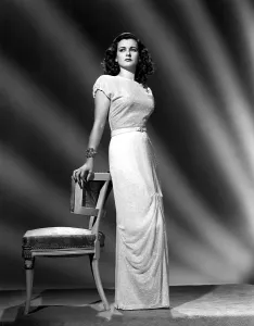 Brooch Prints: JOAN BENNETT, portrait wearing a formal gown designed by Hattie Carnegie