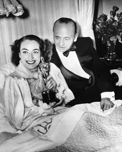 1940s Candid Prints: Joan Crawford, left, in bed with her MILDRED PIERCE Oscar and director Michael Curtiz