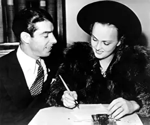 Arnold Prints: Joe DiMaggio and Dorothy Arnold as they file their intent to wed application