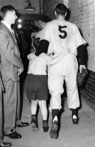 Father And Son Prints: Joe DiMaggio and his son walk to the locker room after the New York Yankees victory in the World Series