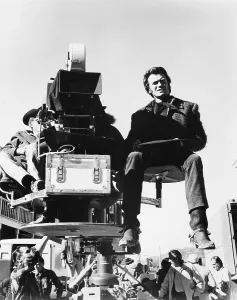 Images Dated 6th March 2015: JOE KIDD, Clint Eastwood riding the camera boom on set, 1972