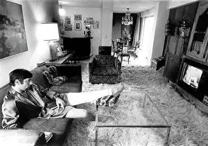 Apartment Prints: Joe Namath, in full-leg cast, watching tv in his Upper Eastside apartment
