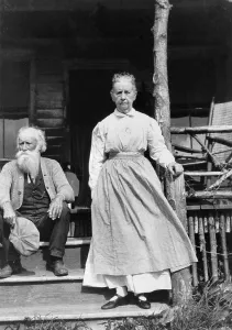 Images Dated 6th March 2008: John Burroughs (1837-1921), American naturalist author seated on steps of house with his wife standing