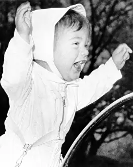 Presidents Family Prints: John F. Kennedy Jr. he stands in his carriage on the White House grounds
