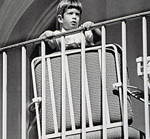 Balcony Prints: JOHN F. KENNEDY Jr. watches a ceremony from a balcony at the White House