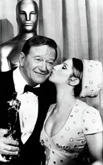 Story 75th Academy Awards Prints: John Wayne congratulated by Barbra Streisand for winning Academy Award for TRUE GRIT