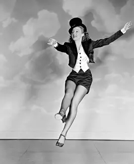 Keyes Prints: THE JOLSON STORY, Evelyn Keyes, rehearsing her dance moves for the photographer, 1946