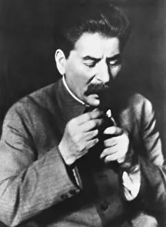 Josef Stalin head of the Communist Party of the Soviet Union lighting his pipe. May 10, 1935. (CSU_2015_11_1378)