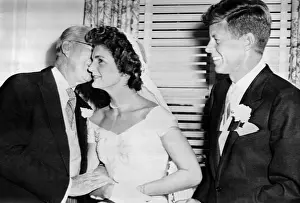 Wedding Portraits Prints: Joseph P. Kennedy kisses his new daughter-in-law