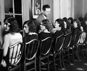 Group Occupational Portraits Prints: J.R. Hirschfield of Detroit choosing models for American Styles Creation Contest
