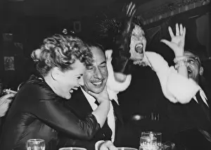 Shouting Prints: Judy Holiday (left) hugs Jose Ferrer after they heard that Ferrer and Holiday both won Oscars