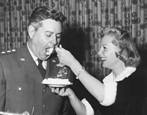 Nebraska Prints: June Allyson serving cake to General Curtis LeMay on the 9th anniversary of SAC
