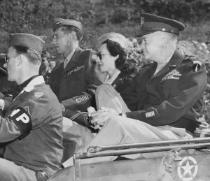 Secretary Prints: Kay Summersby seated between Generals Eisenhower and Mark Clark in a Jeep