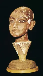 The King Tutankhamun on a lotus flower. 1333 - 1323 BC. Portrait of the Pharaoh. Made with stucco and painted wood. Egyptian art. New Kingdom. Sculpture on wood. EGYPT. Cairo