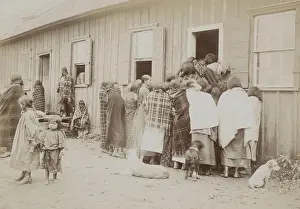Food Prints: Kiowa and Comanche women and children in line for food at a the commissary building in Anadarko