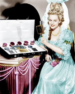 Hand Mirror Prints: KITTY, Paulette Goddard poses with the $25, 000 toiletry set she uses in the film, 1945