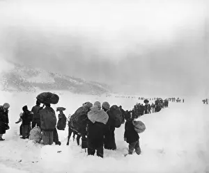 Survival Prints: Korean refugees slog through snow outside of Kangnung (Gangneung)