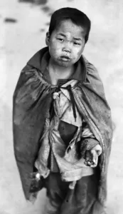 Young Boy Prints: Korean War: A young Korean boy begging for food