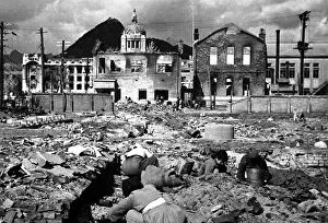 War Victims Prints: Korean women and children search the rubble of Seoul for anything that can be used or burned as fuel