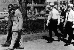 Militants Prints: A Ku Klux Klan Security Patrol walk behind Jeremiah X (left in light suit)