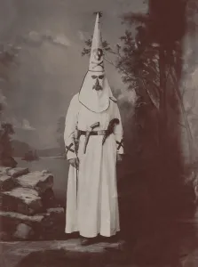 Nativists Prints: Ku Klux Klansman in robes, armed with two pistols and a sword